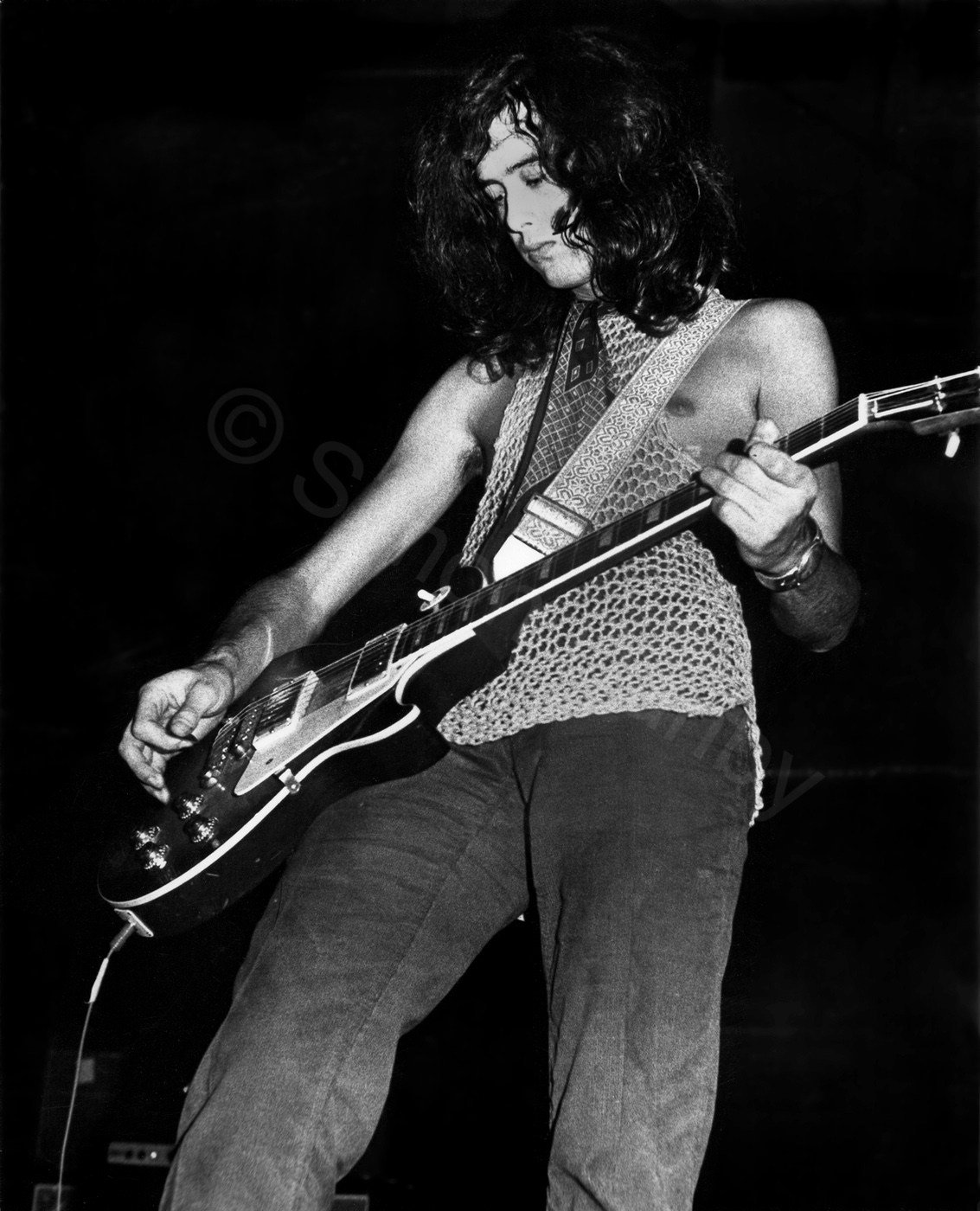 In a Lawrence Corner string vest-Jimmy Page at Newcastle City Hall. !969, I think. Someone stole my standard issue 50 mm lend that night, leaving me with a 24mm and 85mm only. I recall scrabbling around the front row seats after the audience had left- and finding nothing. At least Jimmy Page helped, on his hands and knees. That's when you find out who's a bloated star and who's a decent person. Simon Danby 1969