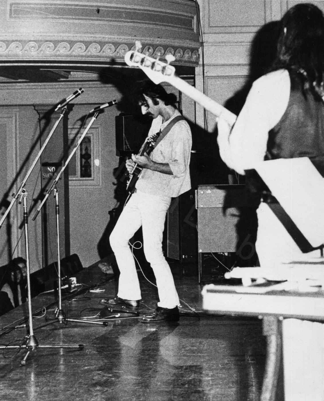 Frank Zappa at the Mothers of Invention afternoon sound-check at Newcastle City Hall. Uncle Meat tour, ?1969.
Zappa stayed in charge of everything- conducting the band's' free singing mercilessly. A few old favourites- 